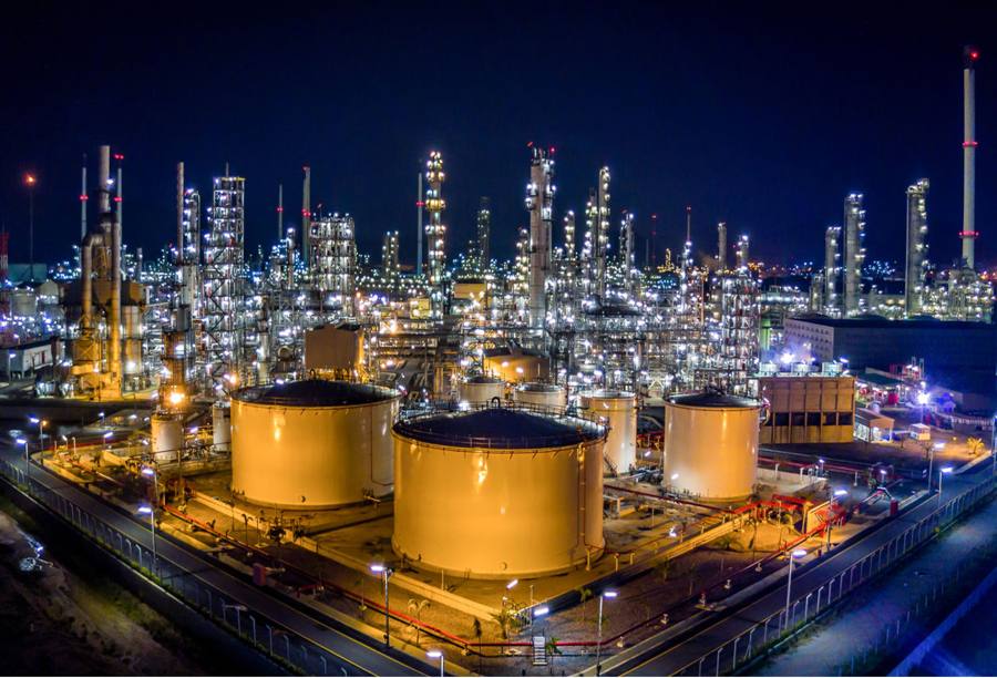 Refinery and tank farm at night